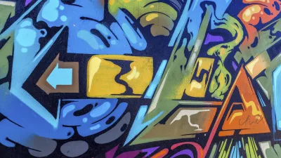 Bunte Graffiti-Wandkunst mit abstrakten Formen und Farbverläufen.